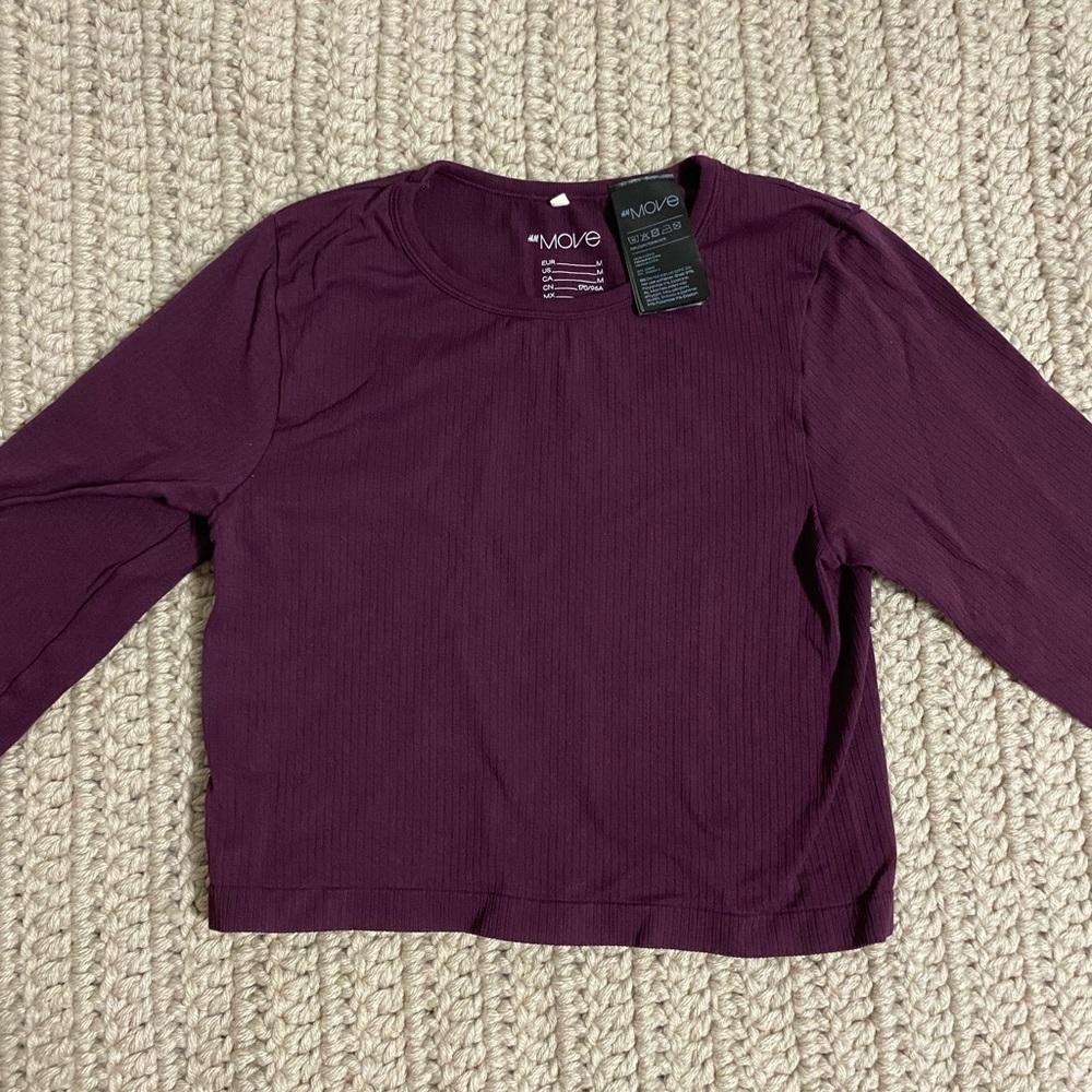 Lightly worn, purple workout crop top.